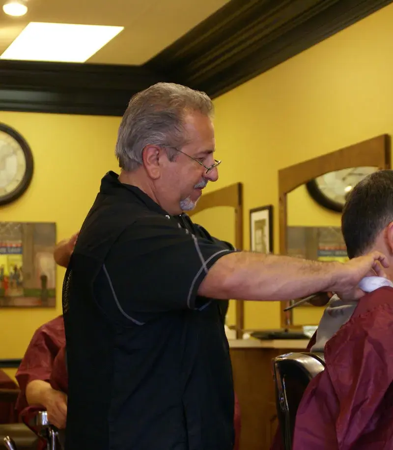 Precision neckline trim with scissors at Wheaton Barber Shop