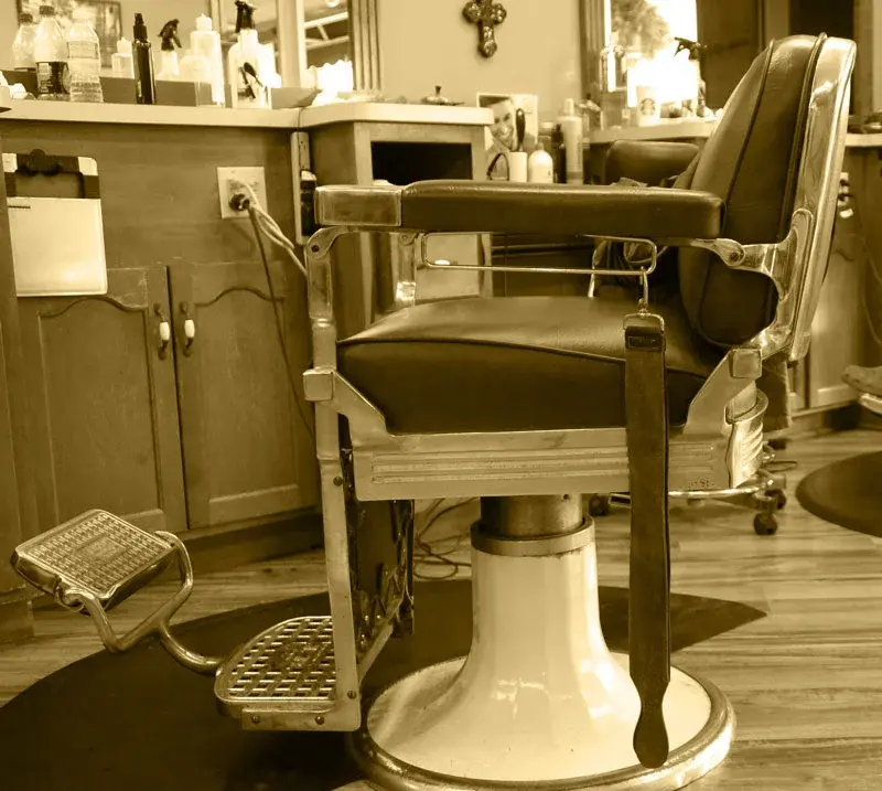 Vintage barber chair at Wheaton Barber Shop of Winfield, Est. 1925