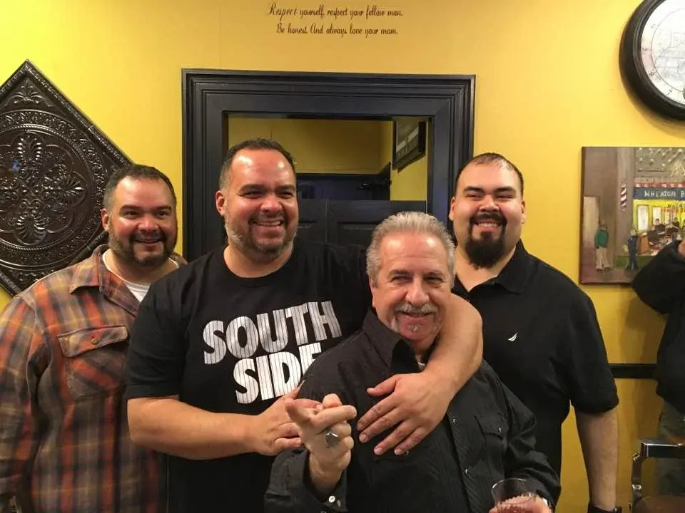 The Wheaton Barber Shop team together inside the Winfield IL shop