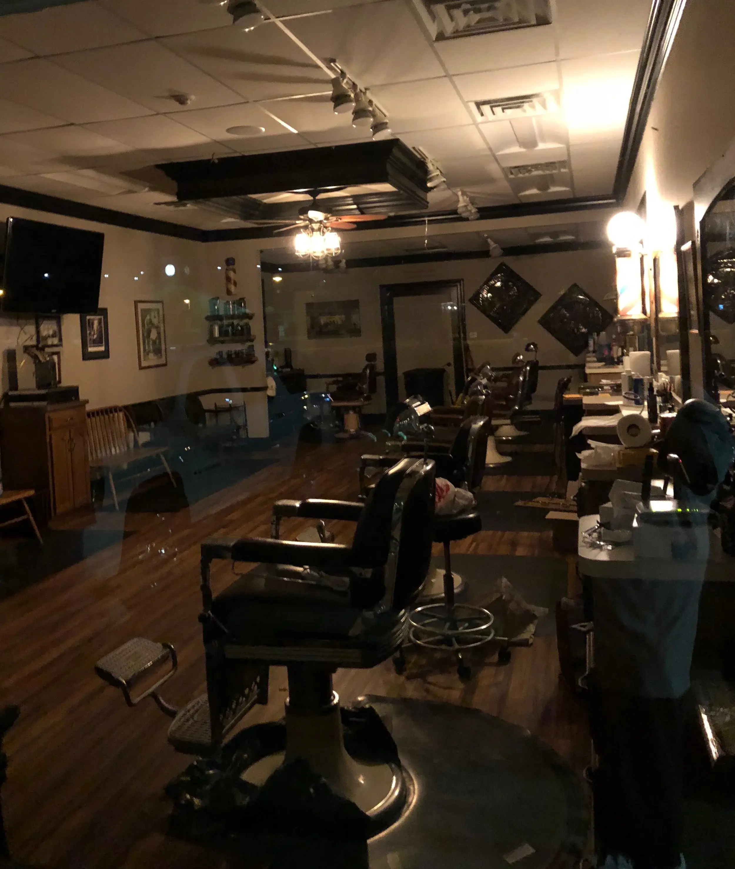 Inside Wheaton Barber Shop — classic barber chairs and hardwood floors in Winfield IL